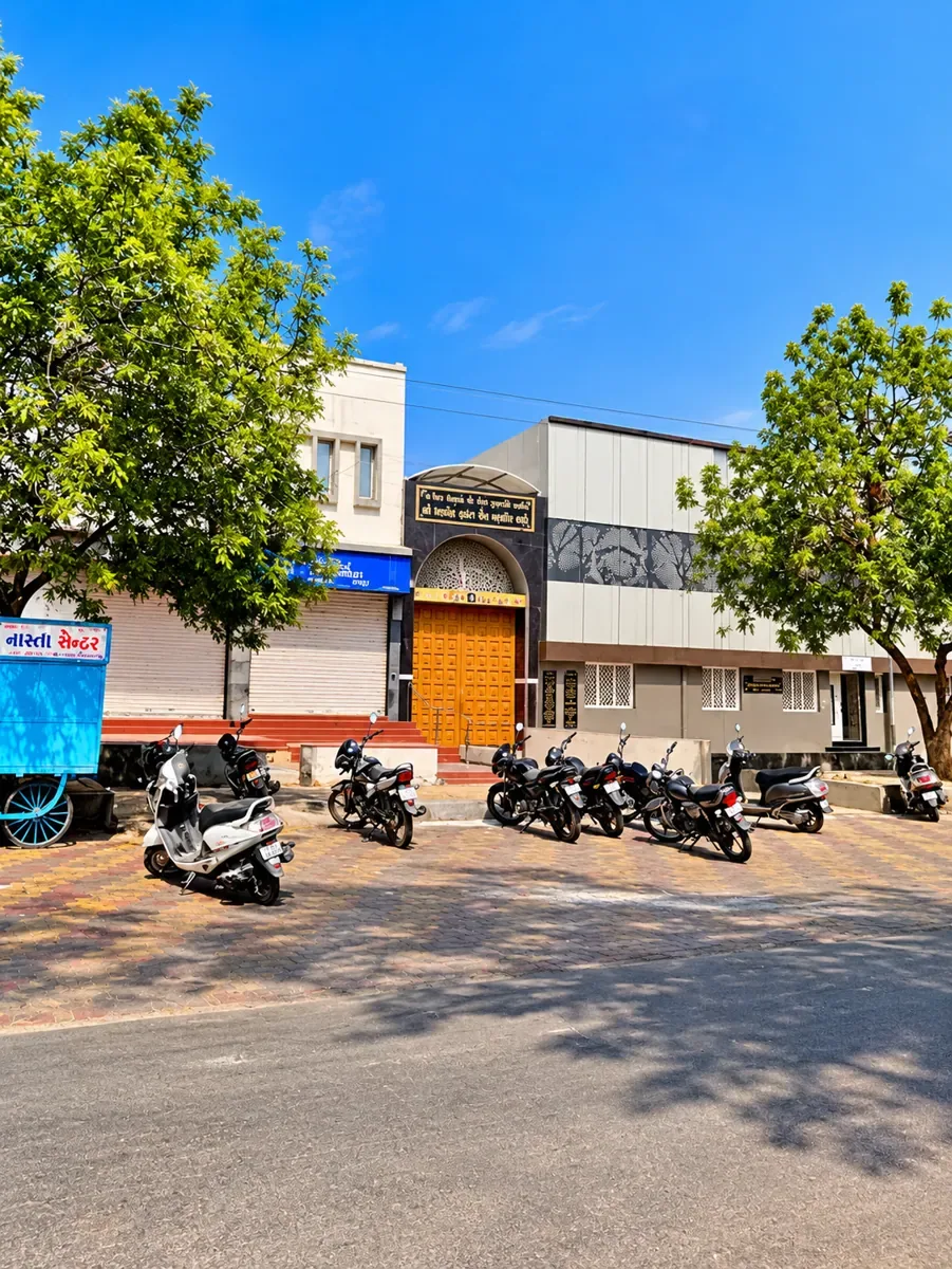 Street view of the dharamshala gate with its arched golden door in Bhuj