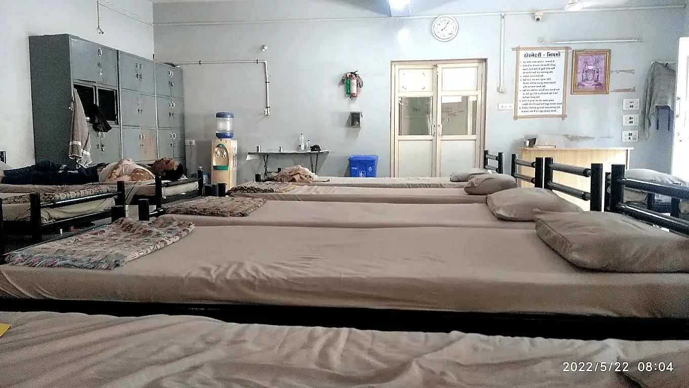 Dormitory hall with steel lockers, drinking water dispenser and rules board